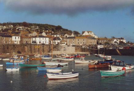 A view across the harbour with small boats