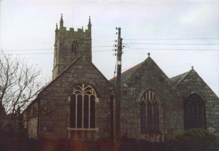 A three aisled church with a square tower at the far end