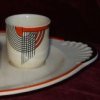 a tango egg cup in orange on its dish