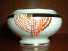 a round tango sugar bowl in red
