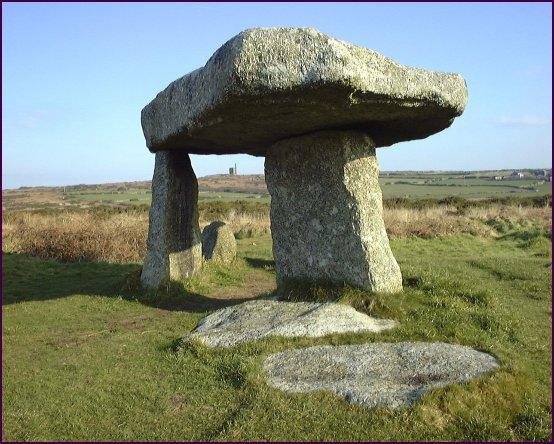 A cromlech with three standing stones and an off-centre table top capstone.