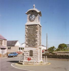 Rhosneigr clock-tower, the site of the camp is to the right